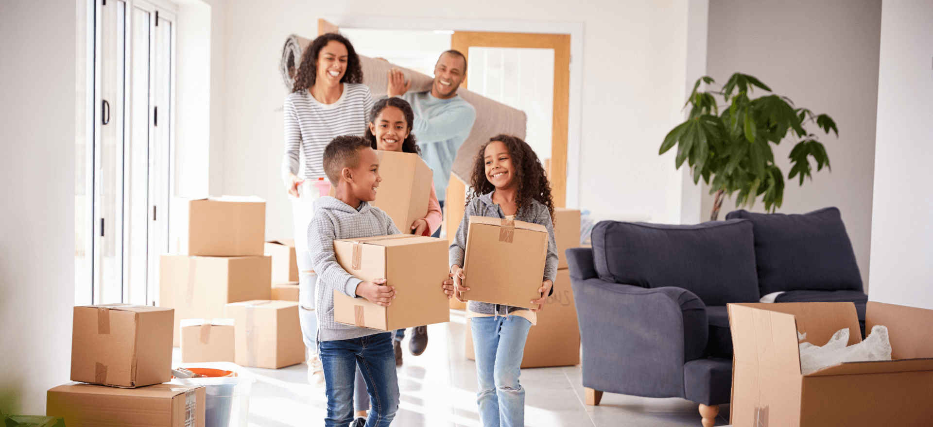 Happy family moving in to their new home thanks to Duane Buziak Mortgage Maestro